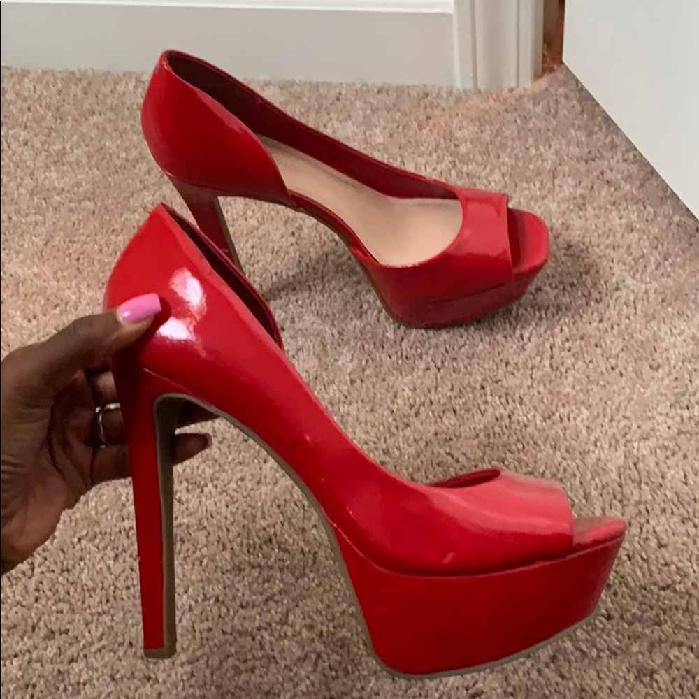 Peep toe red pumps